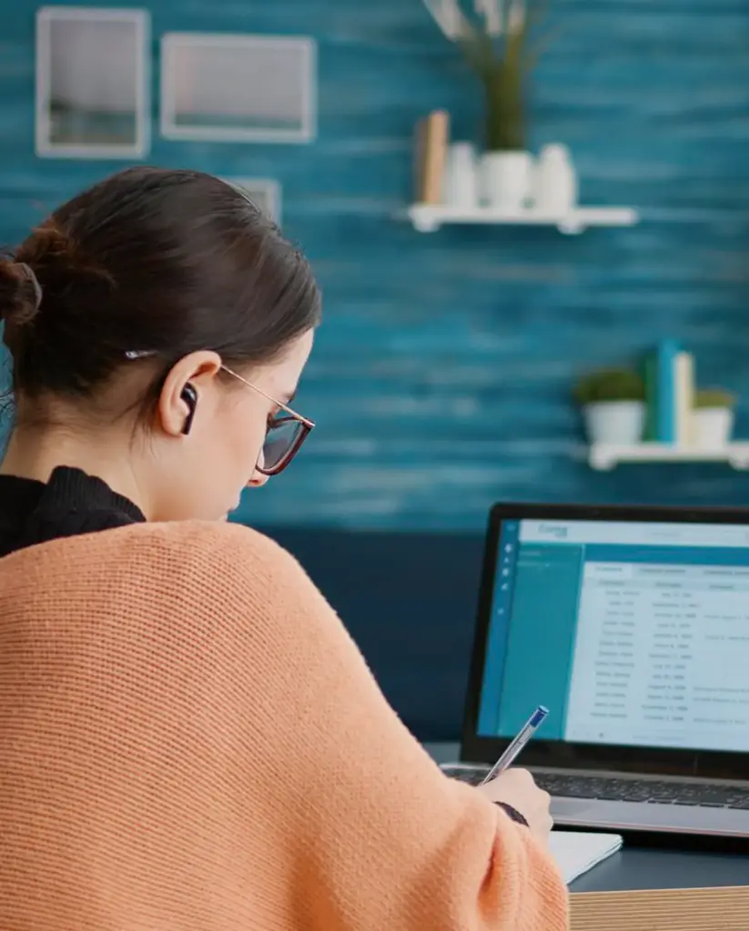 Lady watching a Care Certificate training